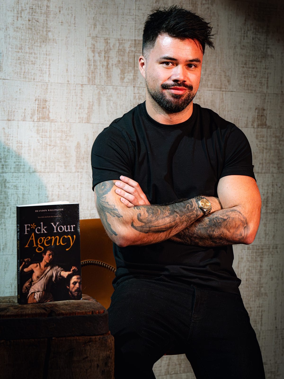 Brandon Willington with his book F*ck Your Agency
